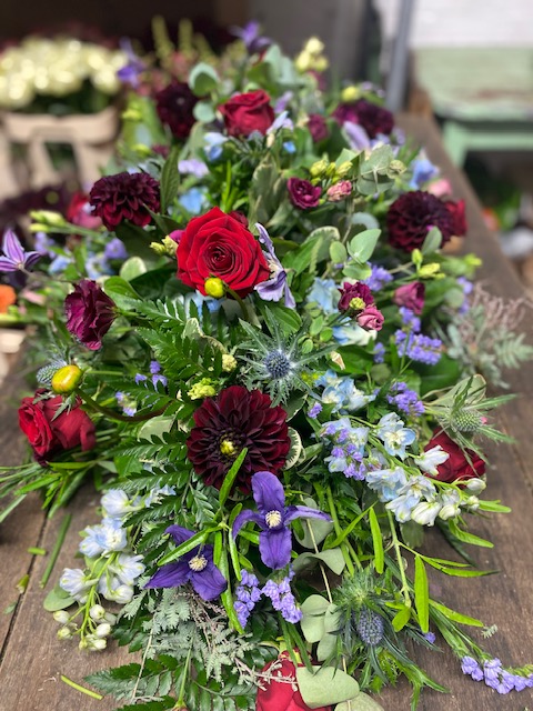 claret and blue coffin spray