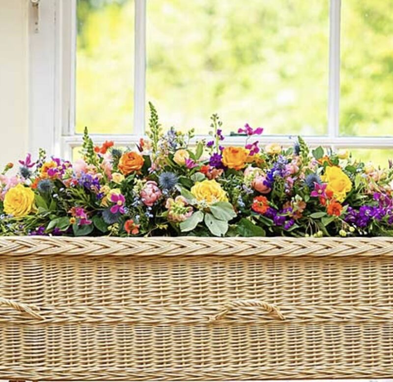 funeral flowers with yellow roses